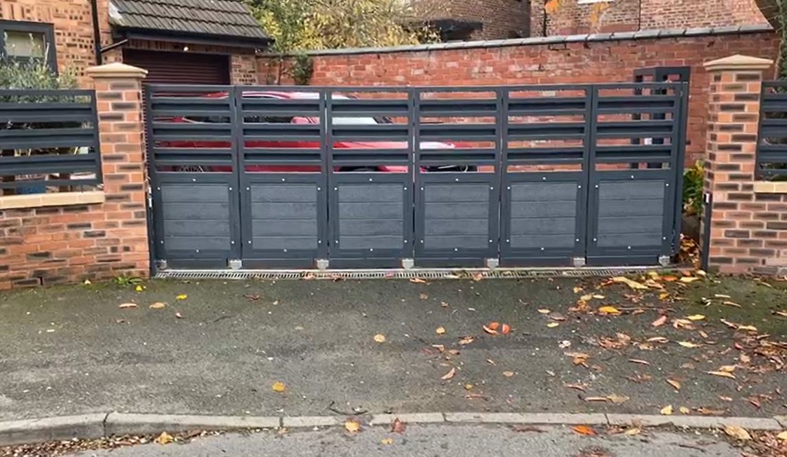 Electric gate securing a driveway